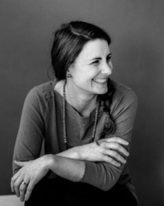 a person smiling and sitting